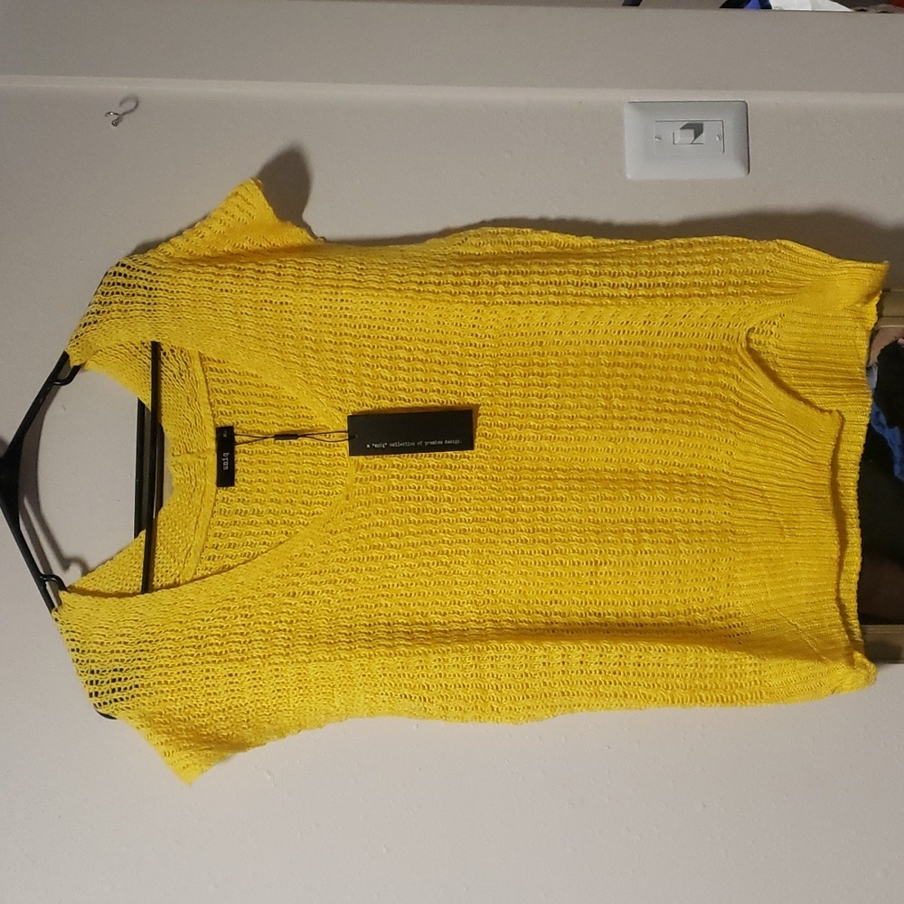 A "Uniq" collection of premium design. Yellow sleeveless sweater women's top Lrg